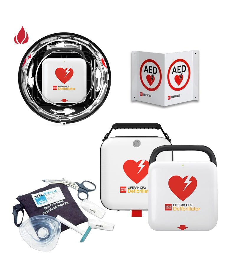A LIFEPAK CR2 AED (Automated External Defibrillator) kit shown on a plain white background, including the main white AED unit with red heart logo, a black circular charging base, a white AED sign panel, a carrying case, a face mask, gloves, and a pouch.