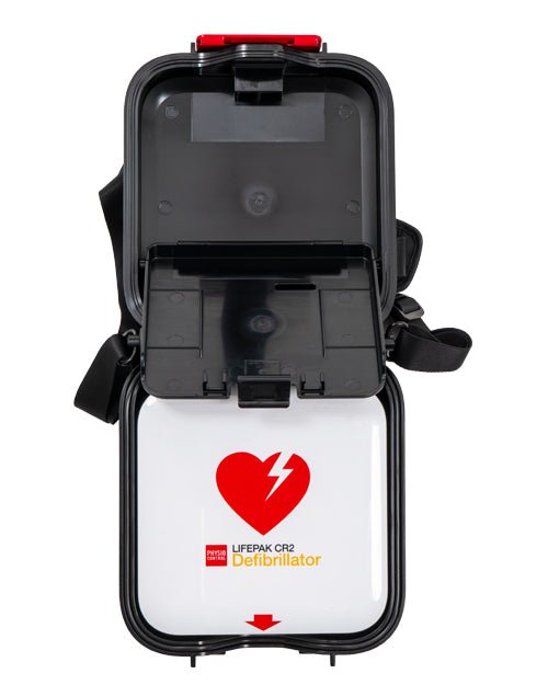 Lifepak CR2 Defibrillator shown open against a white background, featuring a black protective casing, a white interior compartment, and a red heart logo with the Lifepak brand name.